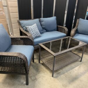Brown resin wicker love seat and two chairs, coffee table and blue cushions